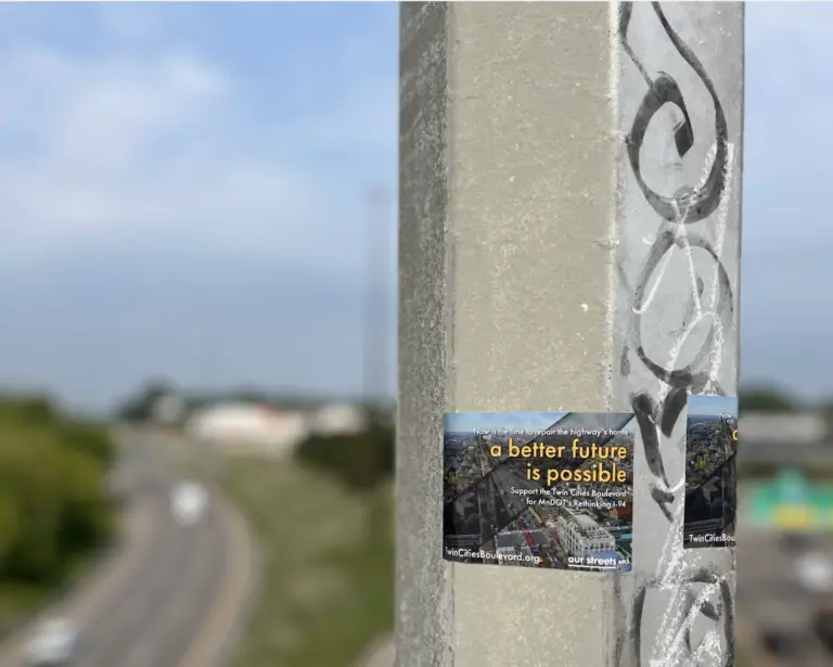 sticker on cement pillar that reads "a better future is possible"